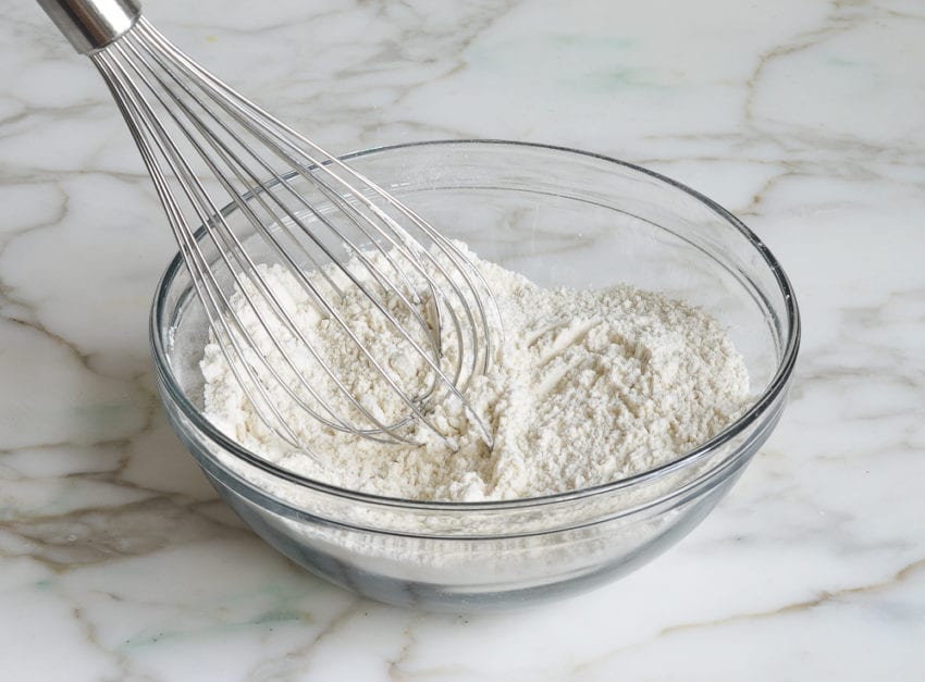 whisking dry ingredients in bowl.
