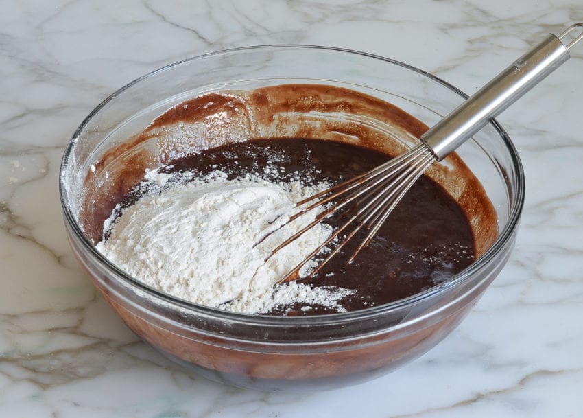 whisked chocolate mixture and flour in bowl