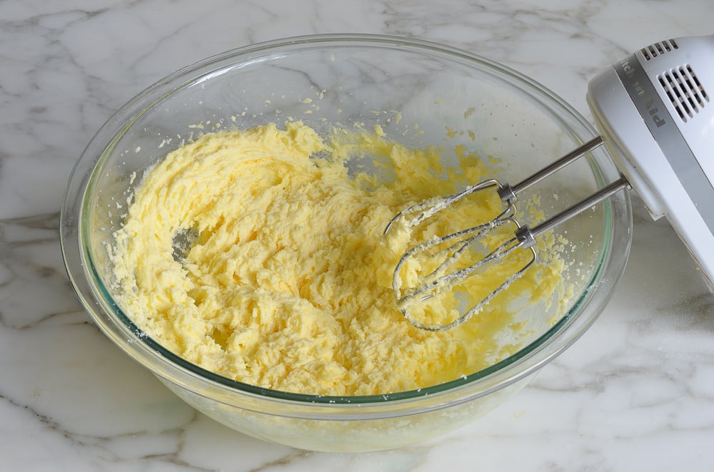 Beaten egg, sugar, and butter in a bowl.