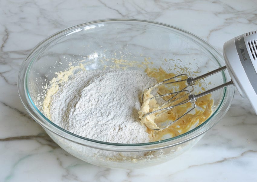 Dry ingredients in a bowl with wet ingredients.