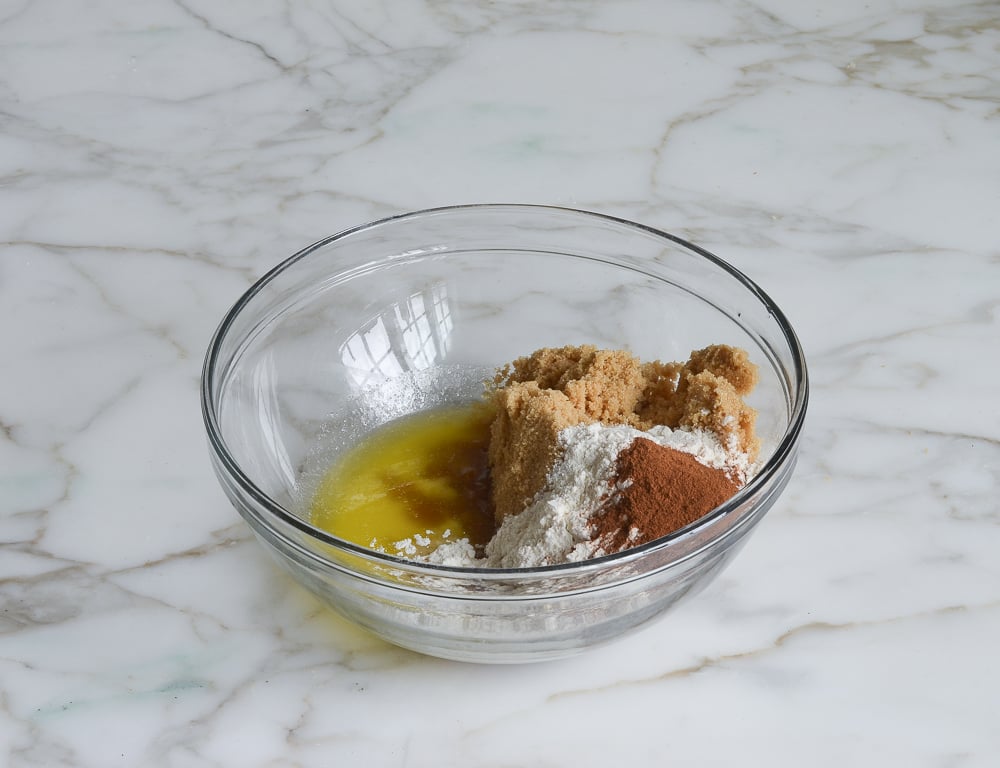 Butter, brown sugar, flour, and seasoning combined in a bowl.