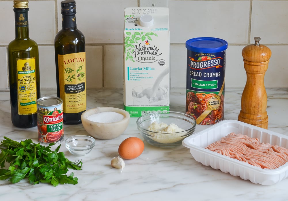 Meatball ingredients including milk, tomato paste, and garlic.