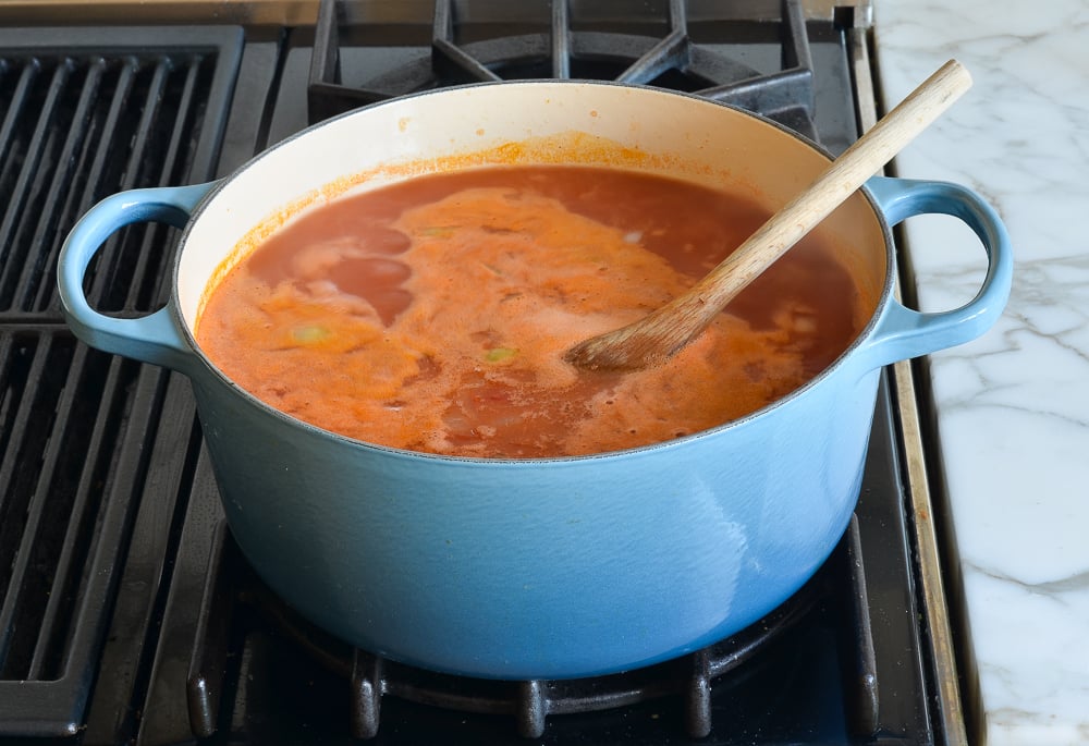 simmering broth in pot.