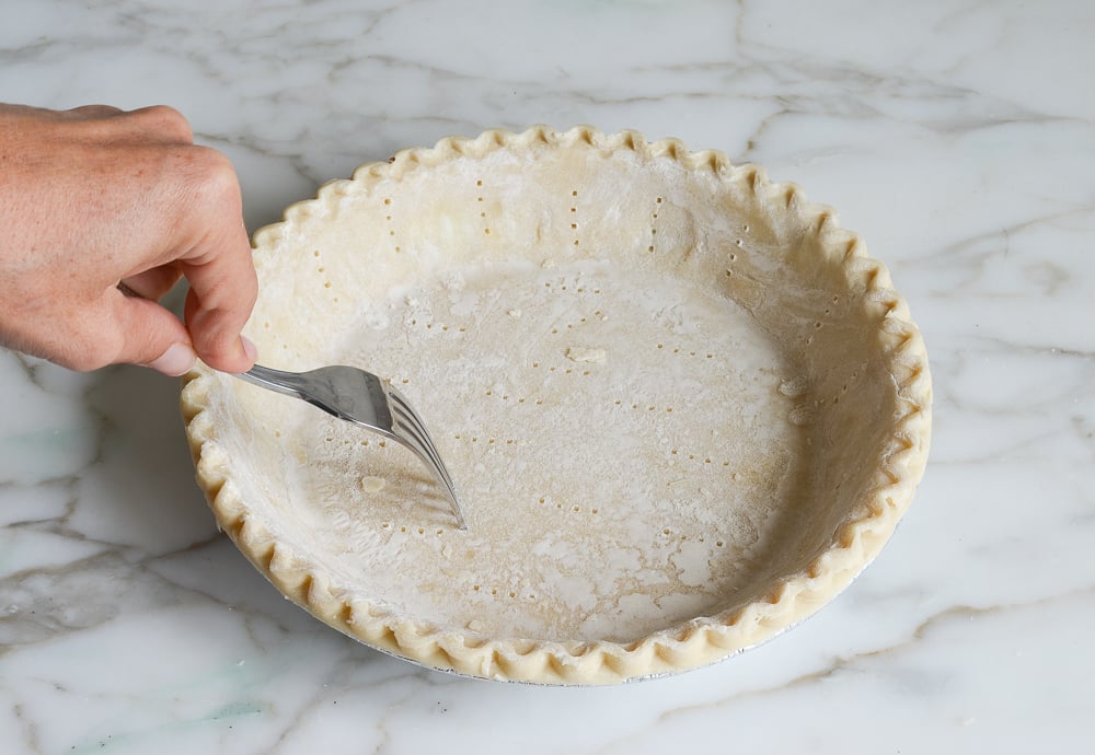 poking the crust with a fork