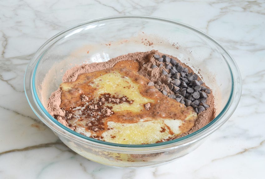 Bowl with chocolate chips, dry ingredients, and buttermilk mixture.