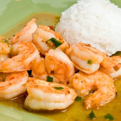 Plate of Thai-style ginger and sweet red chili shrimp with rice.