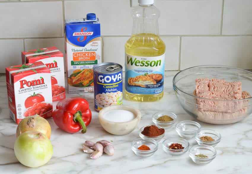 Chili ingredients including cannellini beans, chicken broth, and garlic.