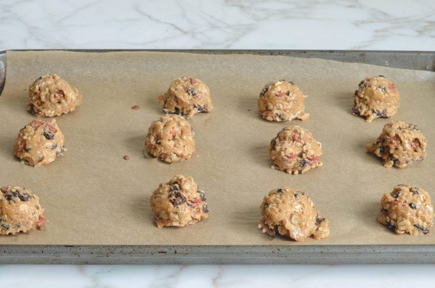 oatmeal cookie dough balls on baking sheet