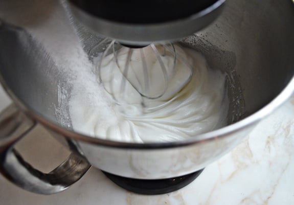 Egg and sugar mixture in a stand mixer.