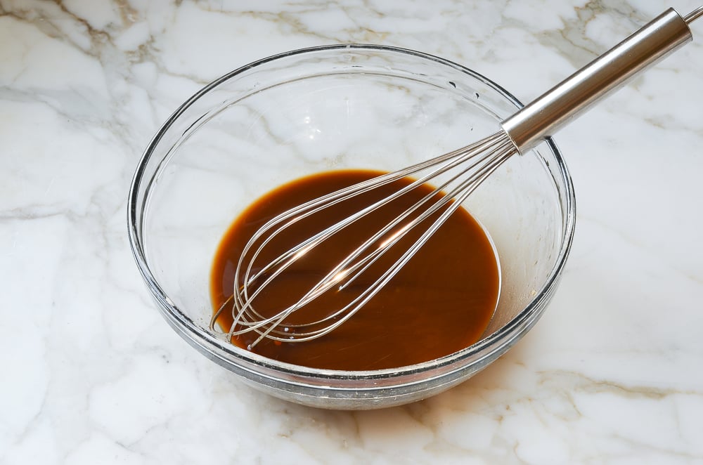 Whisk in a bowl of sauce mixture.