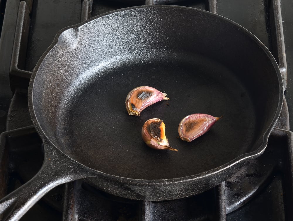 charred garlic in skillet
