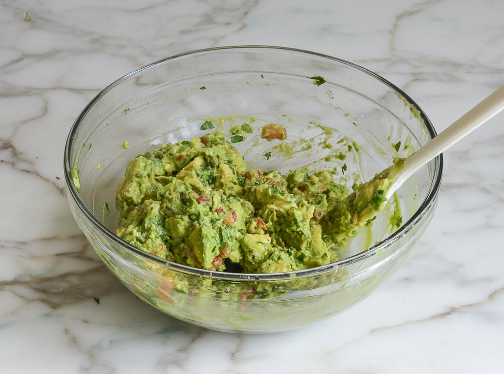 Bowl of roasted garlic guacamole.