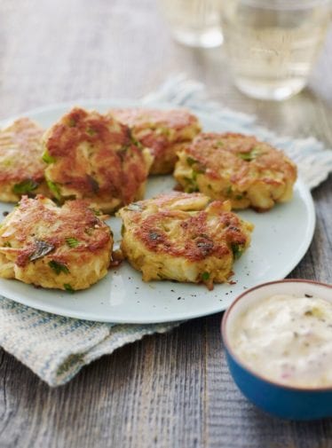 Plate of Crab Cakes with tartar sauce.