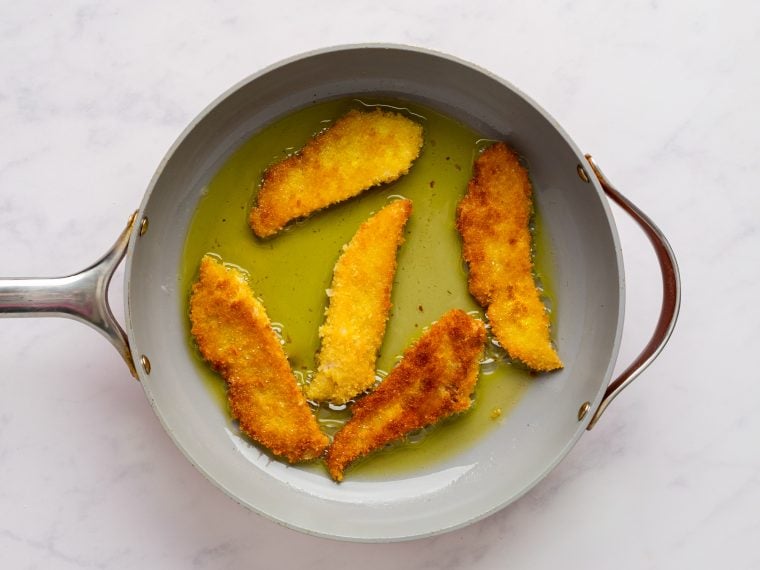 pan frying the fish in a nonstick skillet