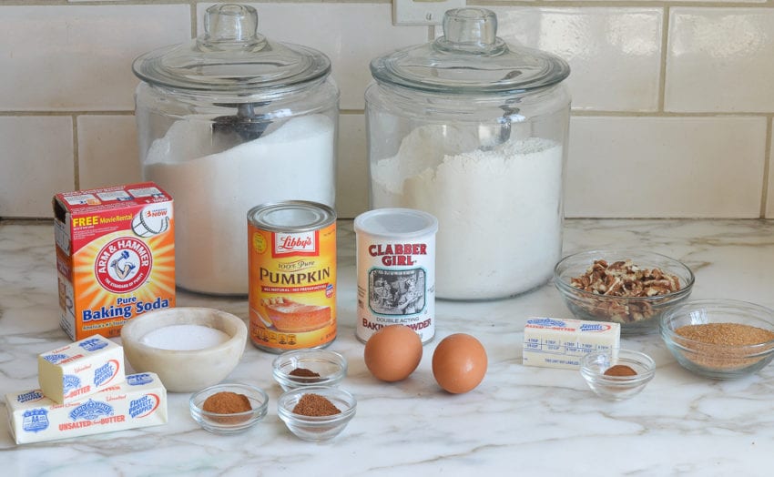 Muffin ingredients including eggs, canned pumpkin, and baking soda.