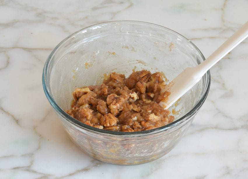Spatula mixing streusel topping.