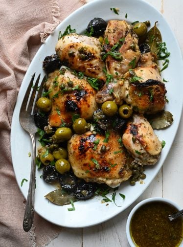 Chicken marbella on a platter.