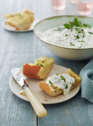 Bread topped with a cottage cheese spread.