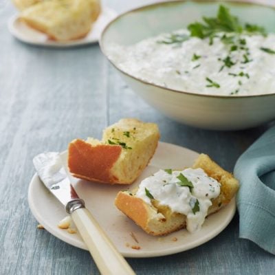 Bread topped with a cottage cheese spread.