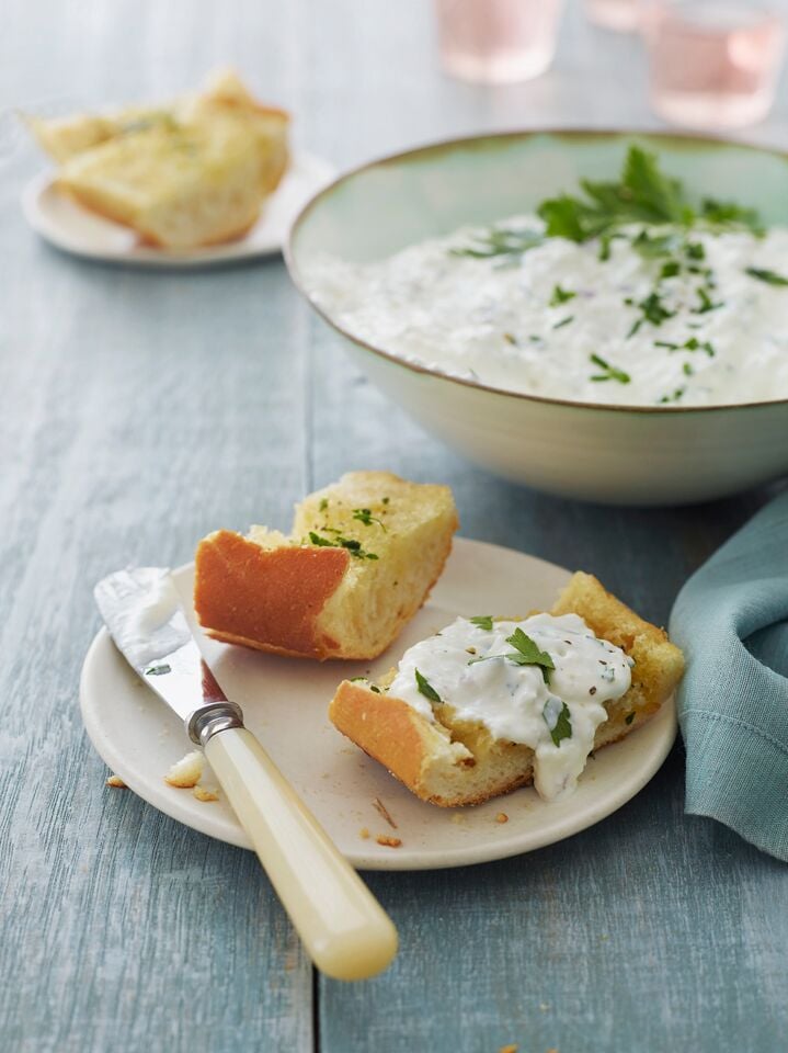 Bread topped with a cottage cheese spread.