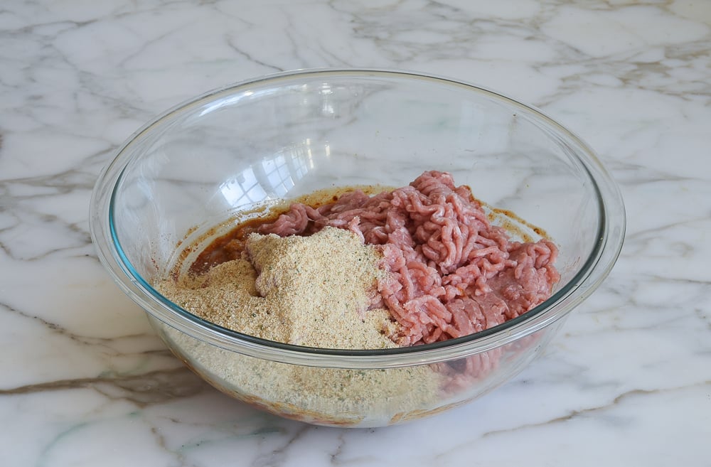 adding the bread crumbs and turkey to the bowl