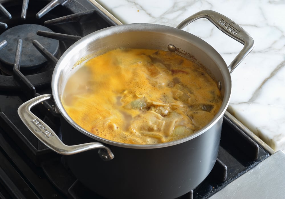 Pot of boiling broth.