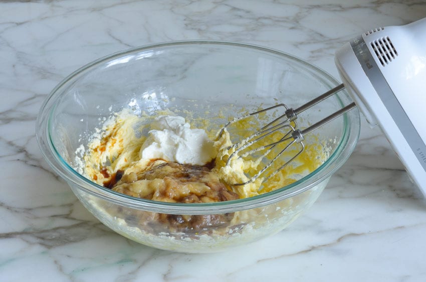 adding sour cream, bananas, and vanilla