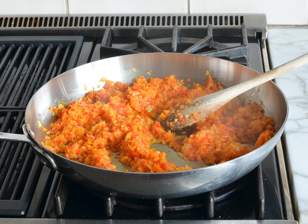 Skillet of cooked, chopped vegetables.