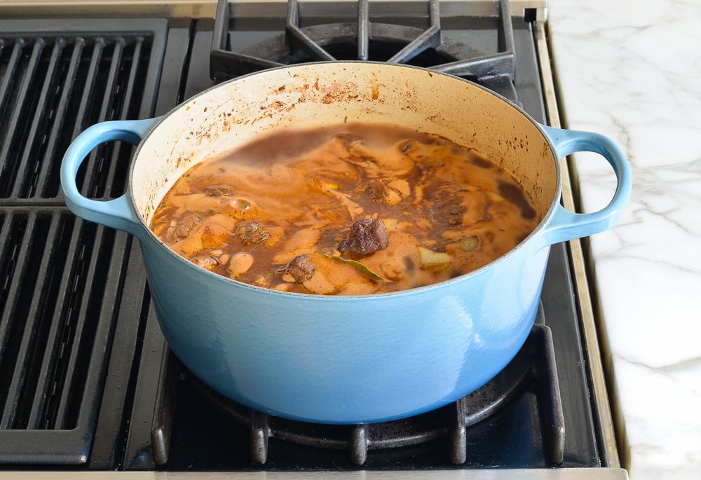 Broth boiling in a Dutch oven.