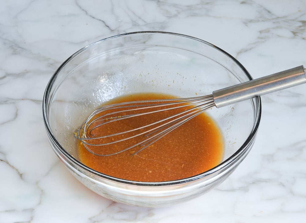 whisked Asian slaw dressing in mixing bowl
