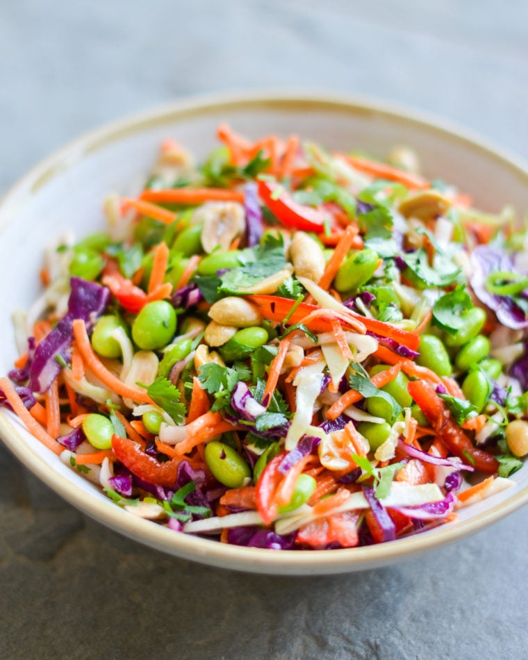 Bowl of colorful Asian slaw with ginger peanut dressing.