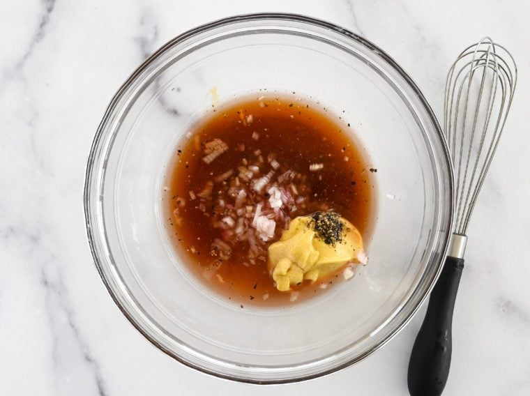 vinegar, mustard, honey, shallot, and seasoning in bowl