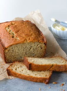 Partially-sliced loaf of banana bread.