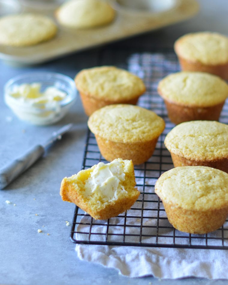 Cornbread muffins on a wire rack.