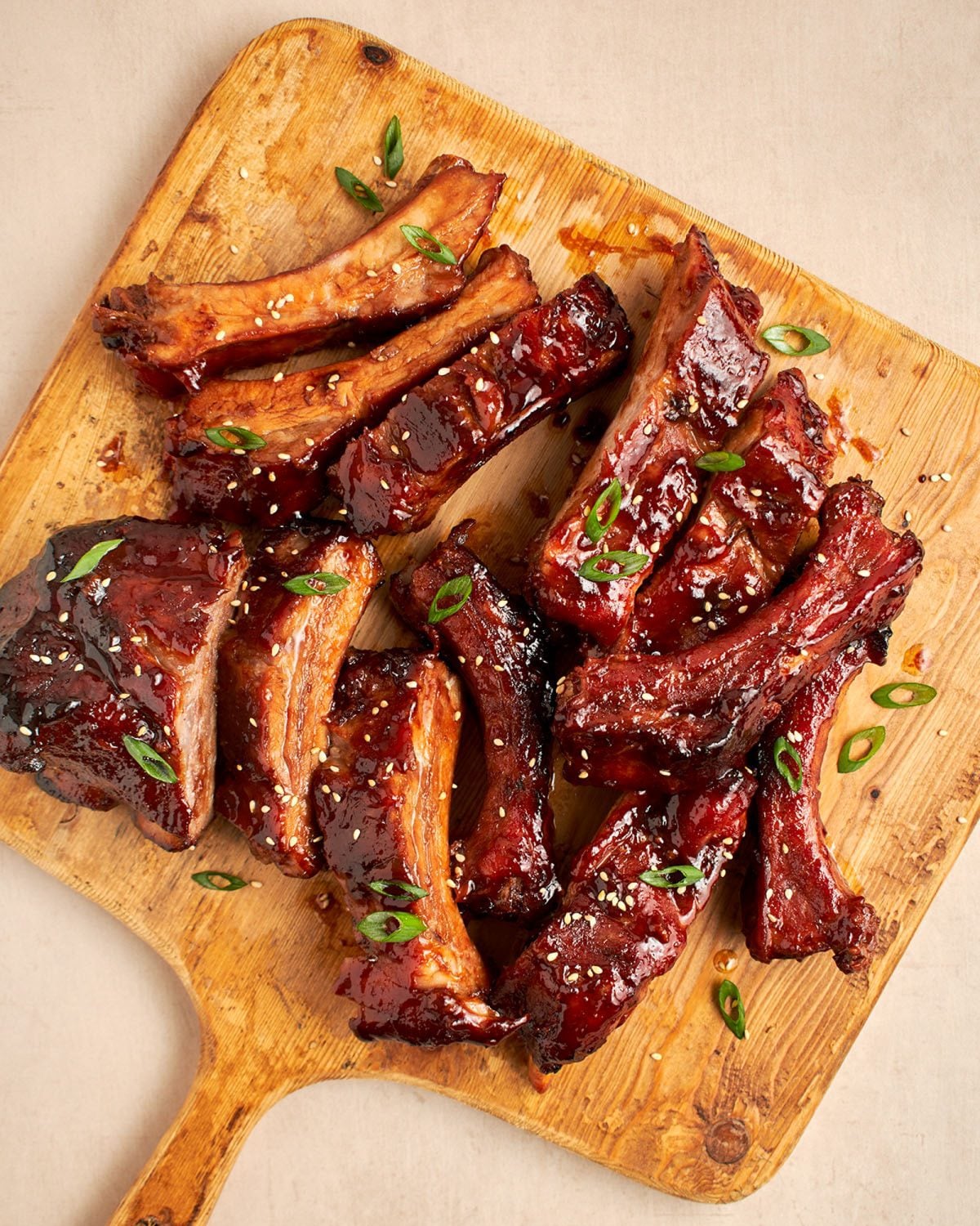 ribs with hoisin bbq sauce on cutting board