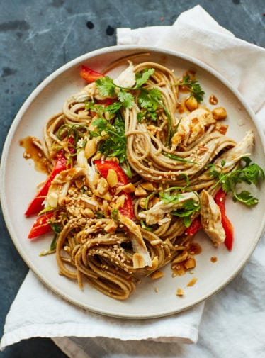 Plate of soba chicken noodle salad with ginger peanut dressing.