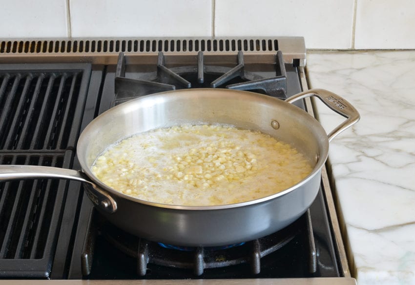 corn and water in skillet
