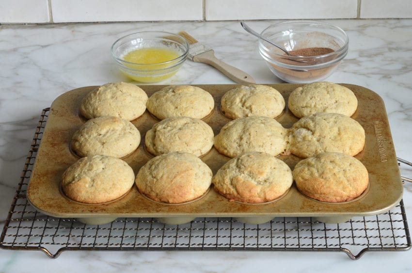 Doughnut muffins in a muffin tin.