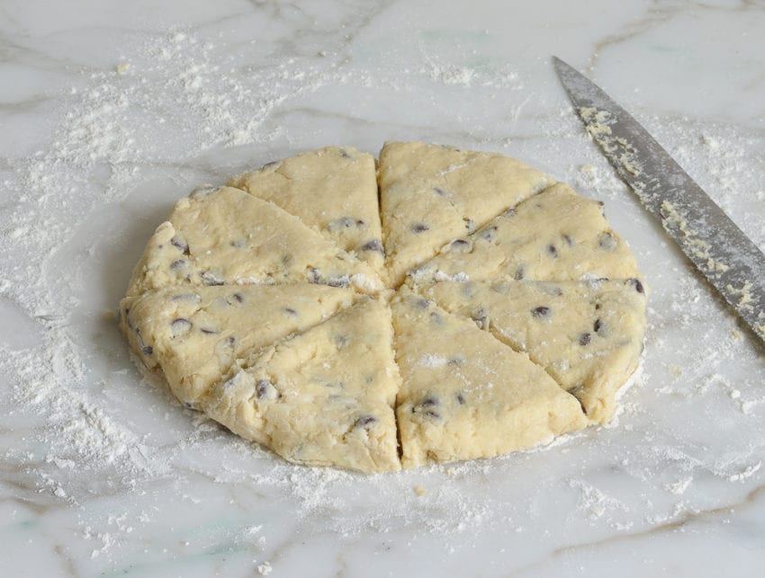 chocolate chip scone dough cut into wedges before baking