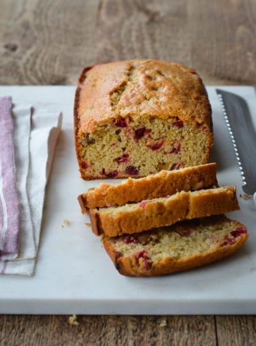Cranberry Orange Bread on cutting board.