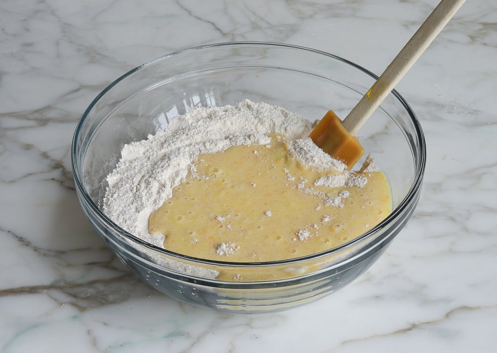 Wet ingredients and dry ingredients unmixed in a bowl.