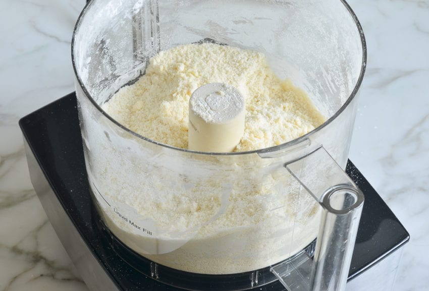 Coarse butter and flour mixture in a food processor.