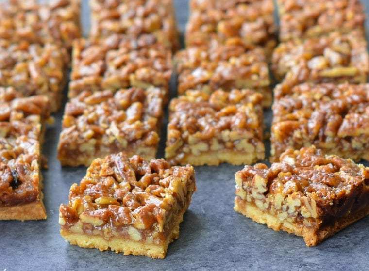 Pecan squares on parchment paper.