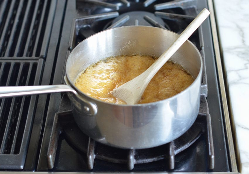 Sauce pan of boiling sugar mixture.