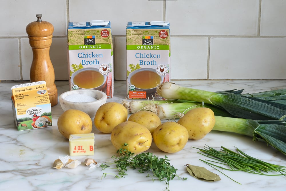Soup ingredients including chicken broth, leeks, and bay leaves.