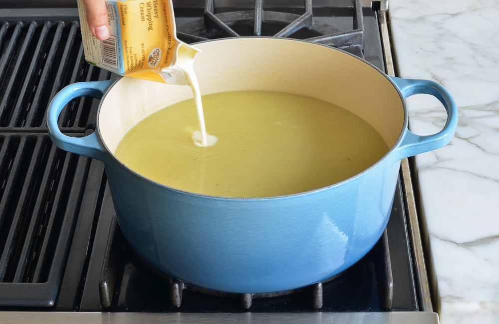 Heavy cream pouring into soup.