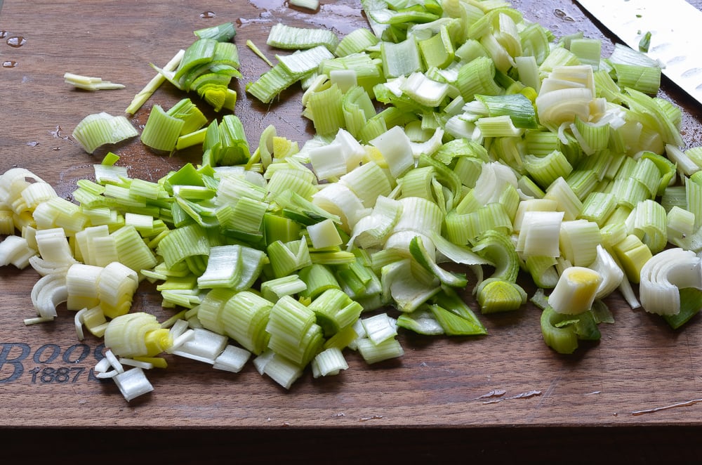 Sliced leeks on a cutting board.