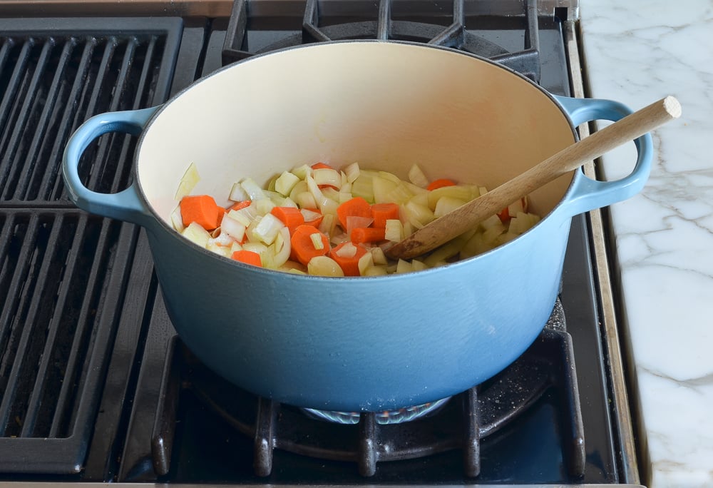 Vegetables in a Dutch oven.