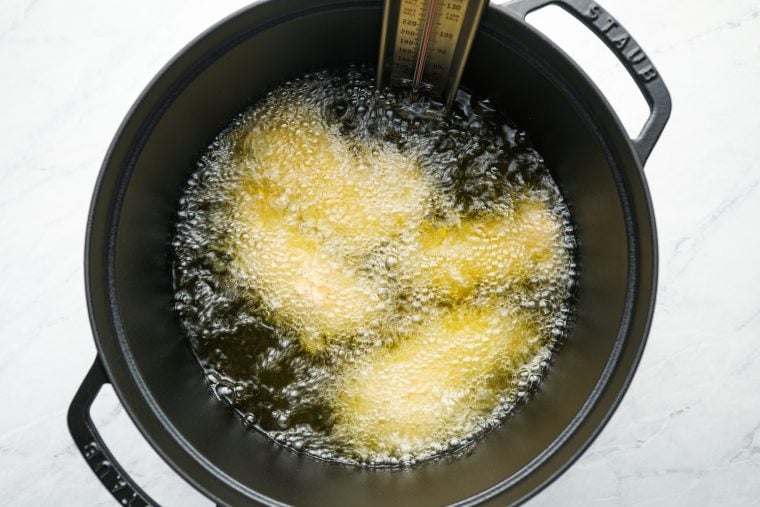 chicken tenders frying in oil
