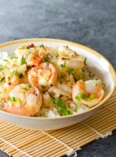 Bowl of Vietnamese-style caramel shrimp over rice.